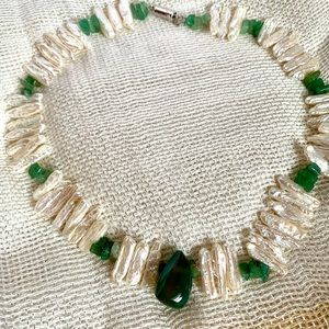 Fresh water pearls one strand with a rough  cut jade pendant